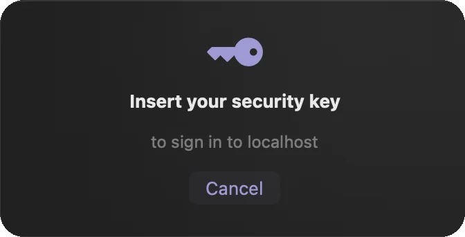 Feather&rsquo;s security key sheet: a key icon, the words Insert your security key, the site that is asking, and a Cancel button.